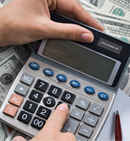 Image of two hands operating a calculator